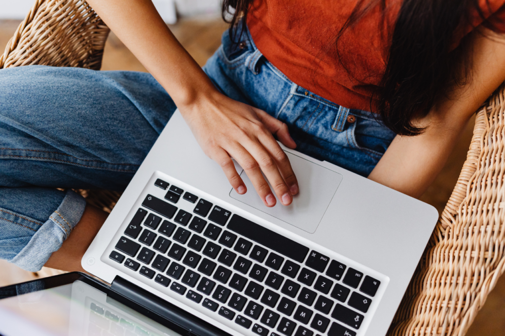 Traveler evaluating an Airbnb listing on laptop using a booking checklist