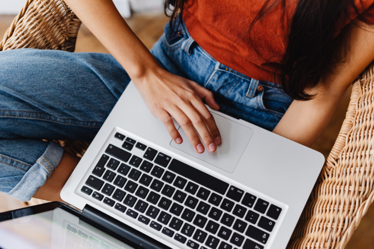 Traveler evaluating an Airbnb listing on laptop using a booking checklist