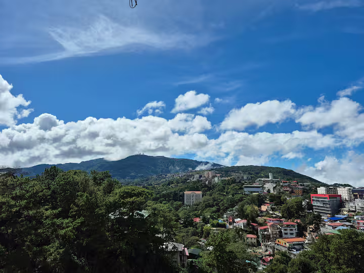 Spacious luxury room balcony with breathtaking Mt. Sto. Tomas view, fresh Baguio breeze, and serene fog-filled mornings.