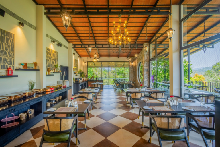 Bright and spacious Airbnb dining area with natural lighting, organized seating, and relaxing mountain view