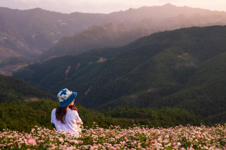 Traveler enjoying a peaceful mountain view in Baguio for mental wellness and stress relief through travel